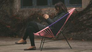 girl in bicolor Acapulco chair Barcelona